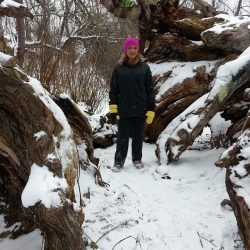 Standing in the center of the Hippie Tree on the trails at Grand Traverse Commons